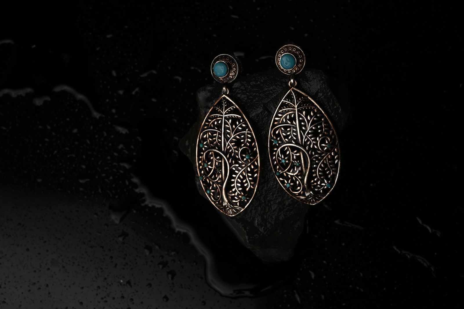 Bronze drop earrings traced from excavated coin designs