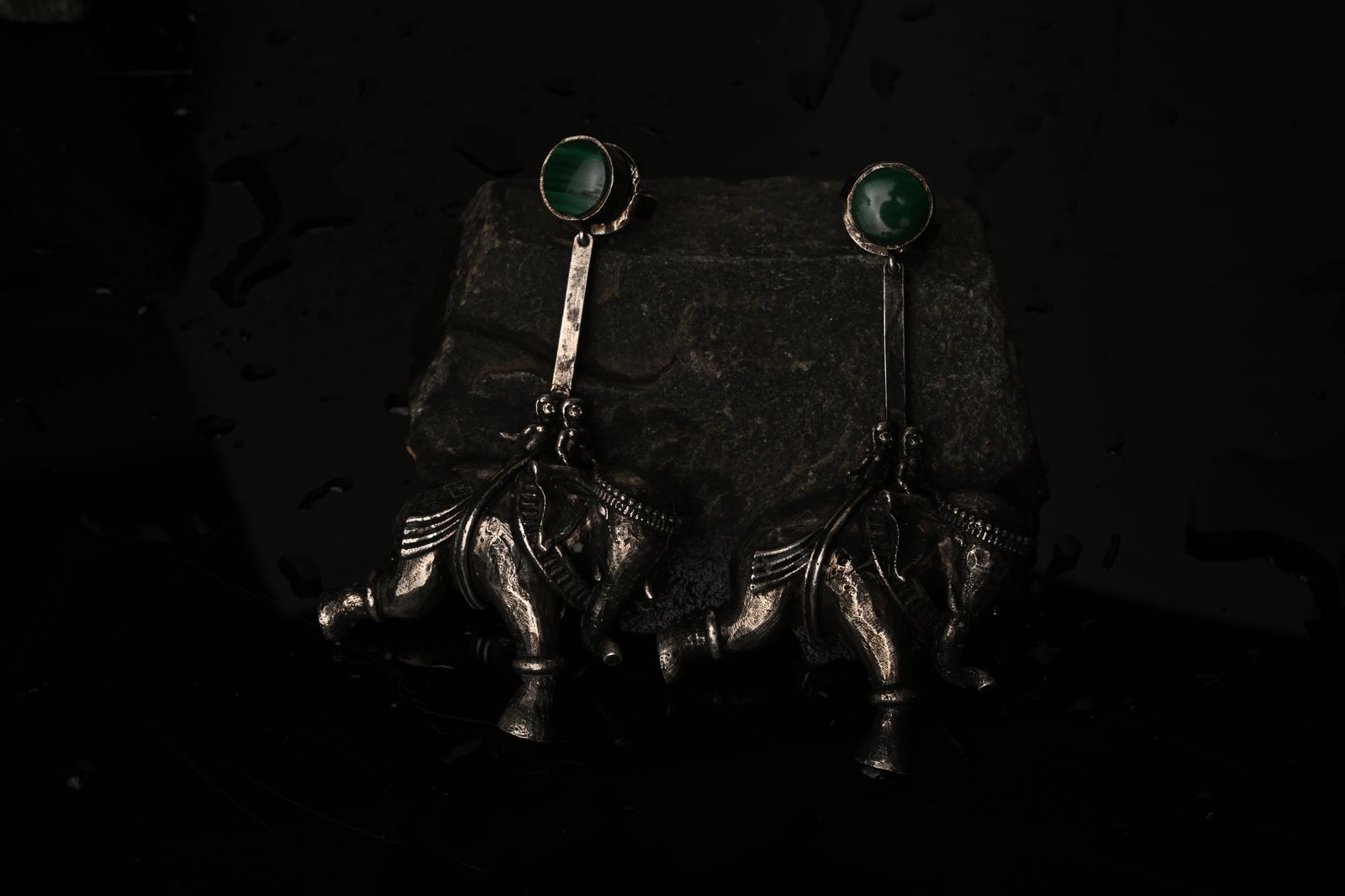 Brass earrings inspired by temple carving motifs