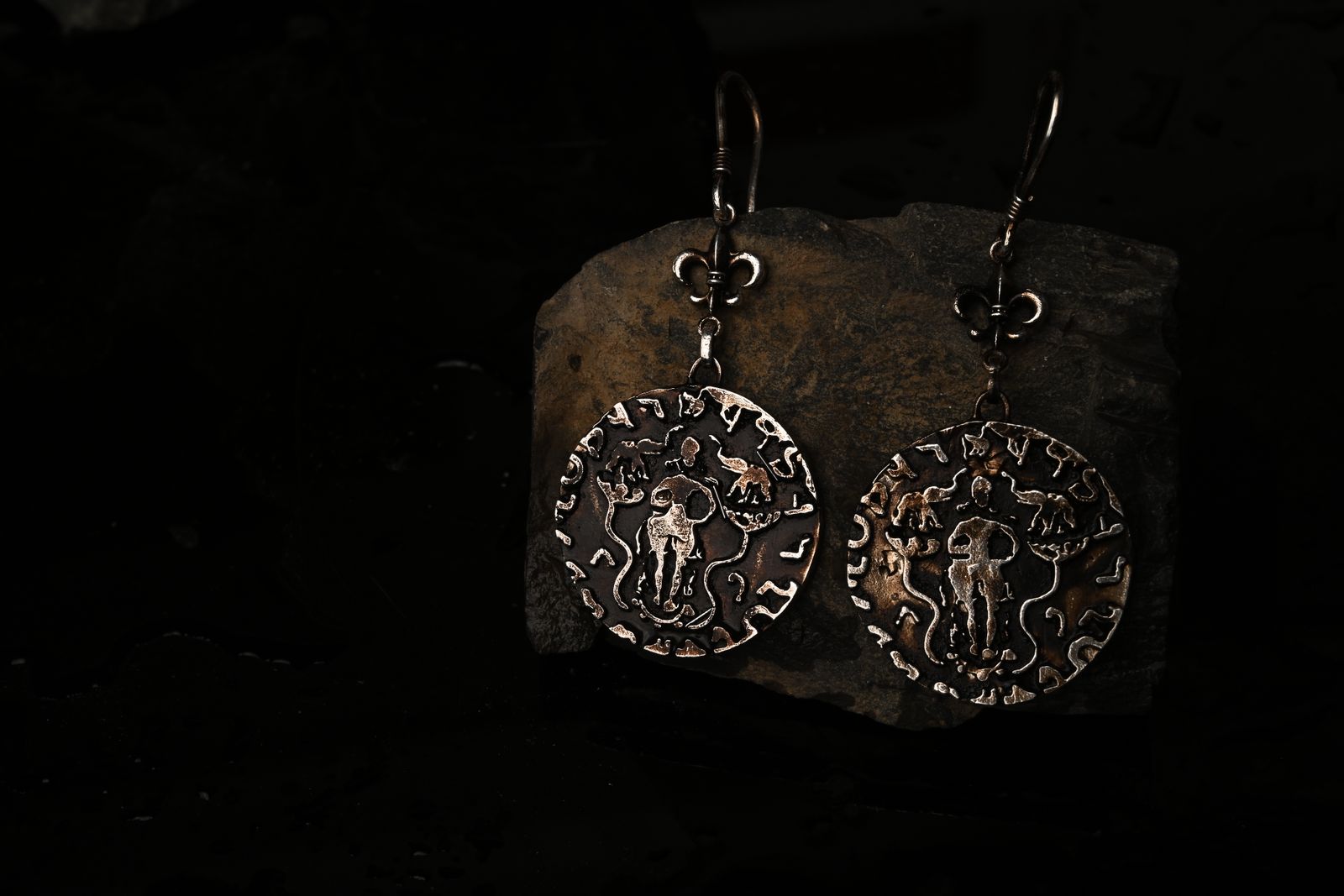 Sculptural brass earrings referencing stepwell architecture